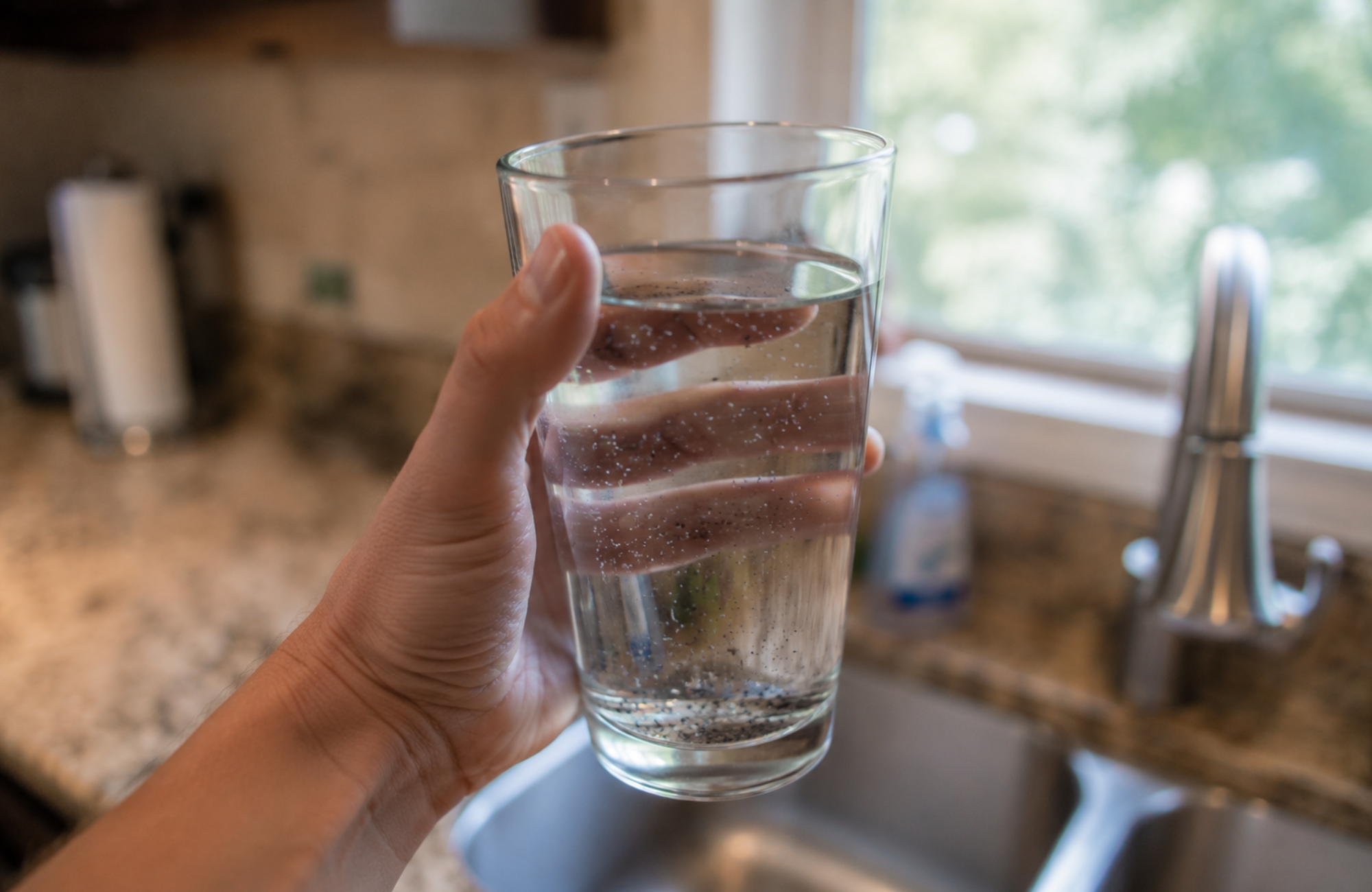 what causes black particles in well water